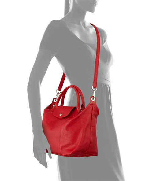 longchamp bag with long strap.